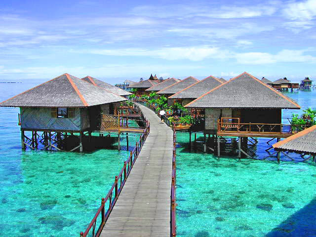 Wooden walkways connecting the water chalets of Sipadan Water Village, Mabul Island